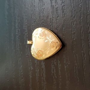 14K gold heart shaped locket.